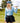 Female Model wearing the Breeze Long-Sleeve Ridgeline Polo holding a golf club on a golf course