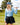 Female Model wearing the Breeze Long-Sleeve Ridgeline Polo holding a golf club on a golf course