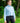Female Model wearing the Breeze Plume Funnel Neck sweatshirt outside with greenery in the background