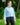 Female Model wearing the Breeze Plume Funnel Neck sweatshirt outside with greenery in the background