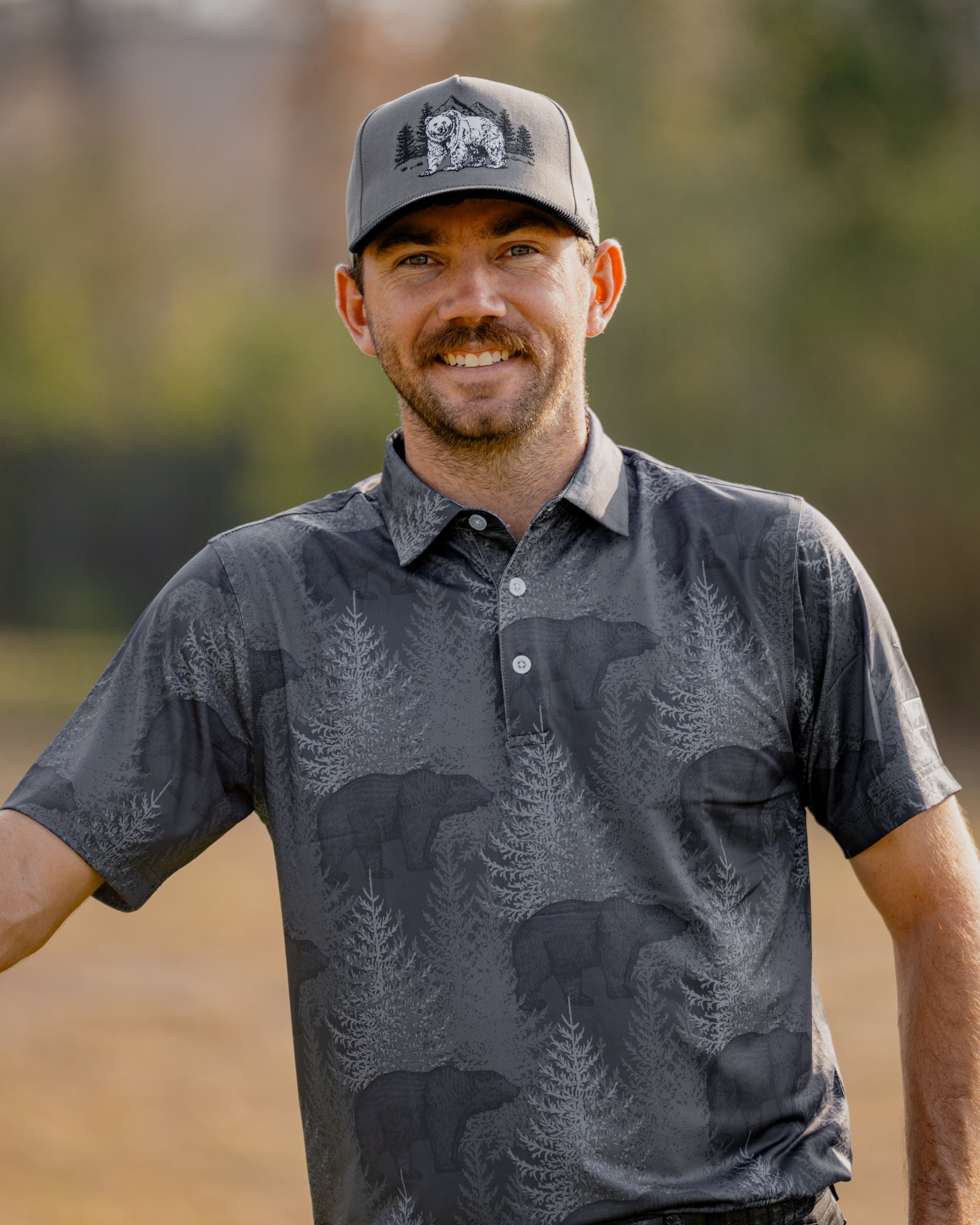 Chandler Phillips wearing Waggle with an outdoor landscape behind him.