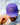 Model wearing the Crazy Eight Hat doing a hat tilt with blue sky in the background.