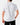 Back of the Cribbage Polo on a model in front of a light gray background.