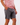 Right side of Dark Gray Scramble shorts on a Model in front of white background