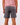 Back of Dark Gray Scramble shorts on a Model in front of white background