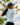 Female model wearing the Downhill Polo on the golf course with greenery in the background