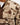 Close up on the Waggle "W" patch on the front of the Duck Blind Sherpa Pullover on a model in front of a light gray background
