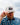 Adam wearing the Duck Hook hat on the golf course, doing a hat tilt with cloudy sky in the background.