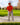 Model wearing the Dustbowl Polo on the golf course getting ready to hit a ball out of a bunker