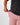 Elastic waist band being pulled on Dusty Rose Scramble shorts on a Model in front of white background