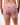 Back of the Dusty Rose Women's League Shorts, on a model in front of a white background