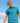 Model wearing the Extinct Polo paired with the Triceraputts Hat on the golf course. Blue sky is featured in the background behind the model