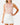 Front of the Fairway Fiesta Sleeveless Polo tucked in on a model in front of a light gray background.