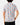 Untucked Back of the Fast Lane Polo on a model in front of a light gray background.