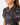 Collar on the Girls Flamingrove Polo on a model in front of a light gray background.