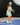 Model wearing the Flora Podium Dress while playing pickleball.