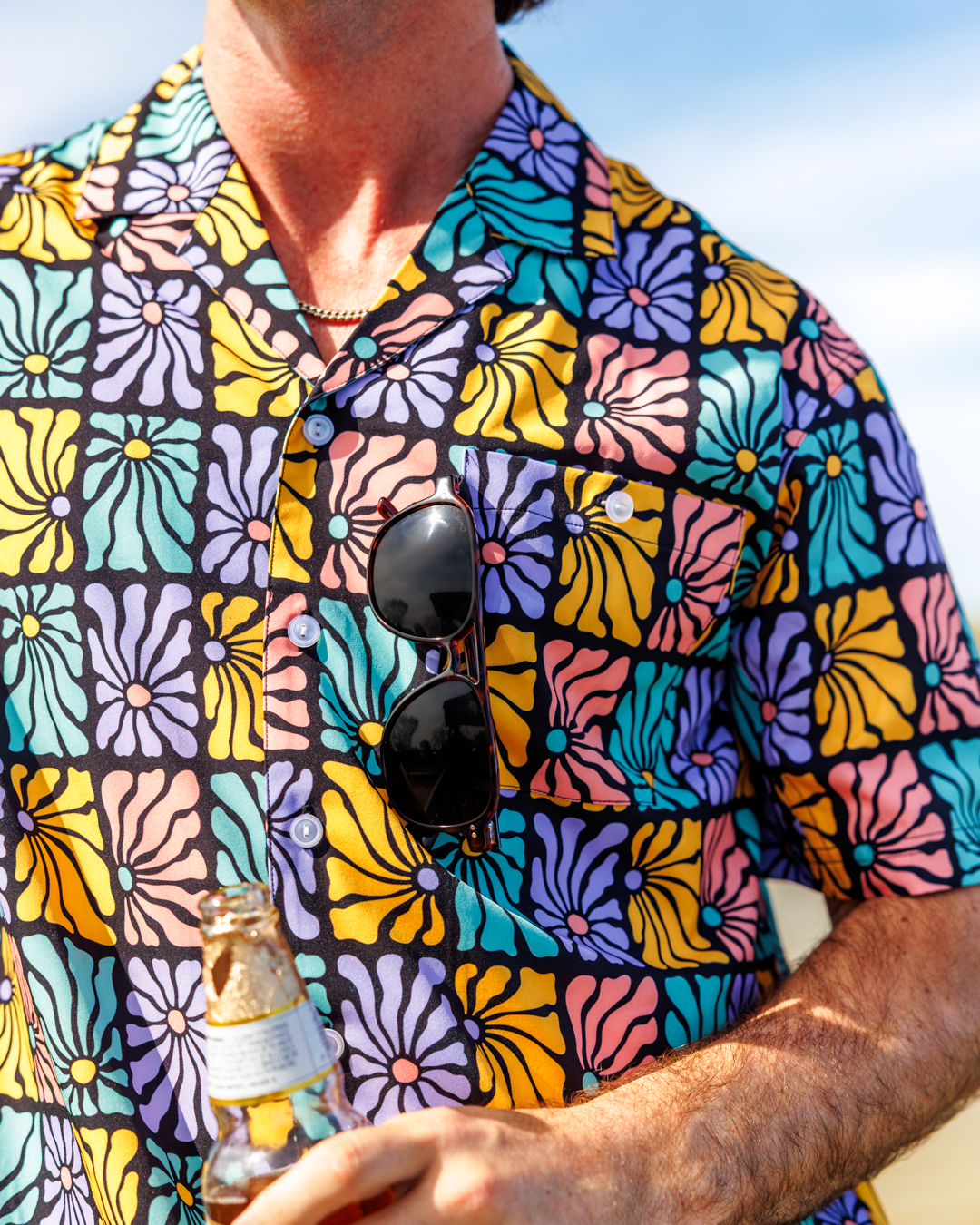 Close up image of Flower Power Camp Shirt showcasing the sunglasses holder feature.