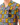 Front chest pocket of the Flower Power Camp Shirt on a Male Model in front of a white background