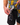 Model using the Microfiber cloth on the bottom of the Flower Power Camp Shirt to clean sunglasses in front of a white background