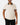 Front of the Flush Habitat Polo on a model in front of a light gray background.