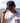 Model wearing the Fore Fuel Unstructured Rope Hat outside with a lake and blue sky as the background
