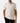 Front of the Fowl Play Polo on a model in front of a light gray background.