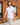 Male Model wearing the Fresh Picked Pique Polo walking down a sidewalk with a brick building in the background