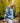 Female model wearing the Freshwater Wildknit Crewneck outside with greenery in the background