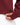 Close up on the Waggle emblem on the front left side of the Garnet Plume Funnel Neck Sweatshirt on a model in front of a white background