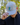 A male model wearing the Great Blue Hat outdoors with greenery in the background