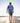 Model wearing the Great Lakes, Great Times T-Shirt outside walking down a dock towards the sunset.