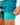 Close up on the compression liner on the Green Lakers Shoreline Short on a model in front of a light gray background.