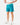 Front 3/4 of the Green Lakers Shoreline Short revealing the elastic waistband and drawstring on a model in front of a light gray background.