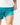 Close up on the compression liner on the Green Lakers Shoreline Short on a model in front of a light gray background.