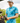 A male model wearing the Hawaiian Punchout Polo on the golf course with greenery & sky in the background