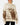 Front of the Highlander Wildknit Sweater on a Female Model in front of a light gray background.