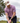 Male model wearing the Hoppy Hour Pique Polo on the golf course with greenery in the background