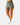 Front 3/4 of the Hunter Green Momentum Shorts on a model in front of a light gray background.