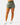 Front of the Hunter Green Momentum Shorts on a model in front of a light gray background.