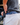 Male tucking his polo into his pants, showing the new Waggle Boxer Briefs as he does so.