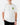 Front of the Knee High By July T-Shirt on a model in front of a light gray background.