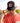 Model wearing the Lake of the Loon Lodge Trucker hat doing a hat tilt with greenery in the background