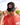 Model wearing the Lake of the Loon Lodge Trucker hat doing a hat tilt with greenery in the background