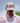 Model wearing the Lobstah Hat on the golf course with blue sky in the background