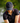 Model wearing the Loon Lake 2.0 Flight Hat on the Golf course with greenery in the background