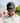Model wearing the Lured In Hat on the Golf Course with Greenery and the sky in the background