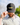 Model wearing the Lured In Hat on the Golf Course with Greenery and the sky in the background