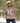 Female model wearing Wildknit Crewneck Sweater while standing by a pond.