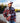 Model wearing the Moose Jaw Sherpa pullover outside with a lake and greenery in the background