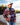 Model wearing the Moose Jaw Sherpa pullover outside with a lake and greenery in the background